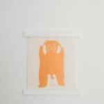 white and orange dog wall decor